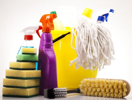 Service terms document displayed beside cleaning equipment and checklist